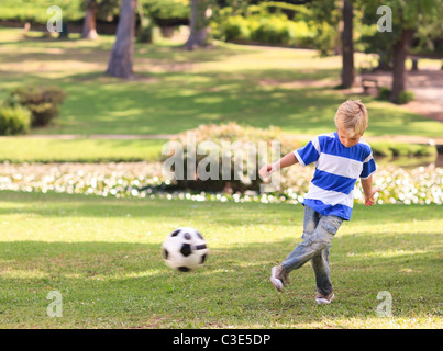 Boy playing football in the park