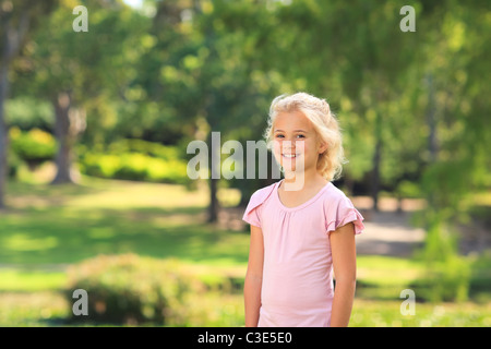 Little girl in the park during the summer Stock Photo