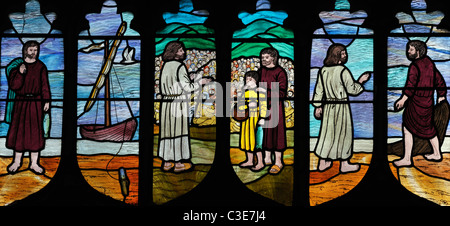 Modern stained glass windows depicting 'the feeding of the five thousand', Brinton, Norfolk, England Stock Photo