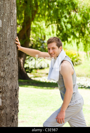 Man doing his stretches in the park Stock Photo