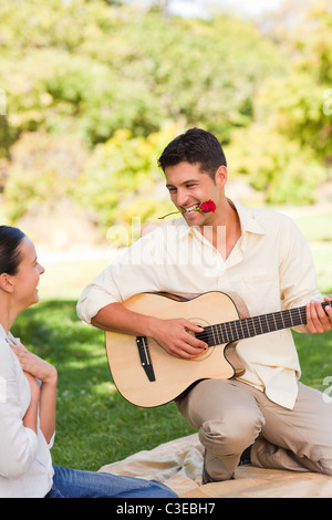 Handsome man playing guitar Stock Photo