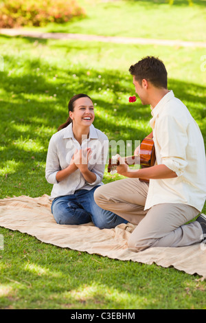 Handsome man playing guitar Stock Photo
