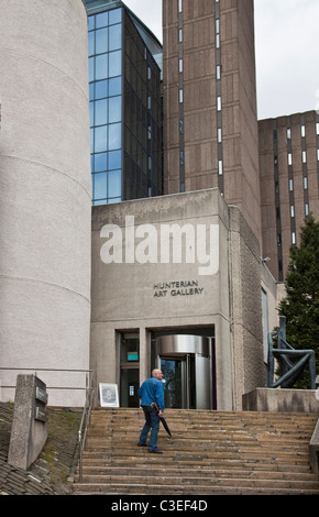 Visitor on the steps of the Hunterian Art Gallery, part of the Library Complex within Glasgow University Campus in Hillhead in the West End. Scotland, Stock Photo