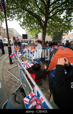 Royal wedding spectators outside Westminster Abbey a day before the royal wedding in central London. Stock Photo