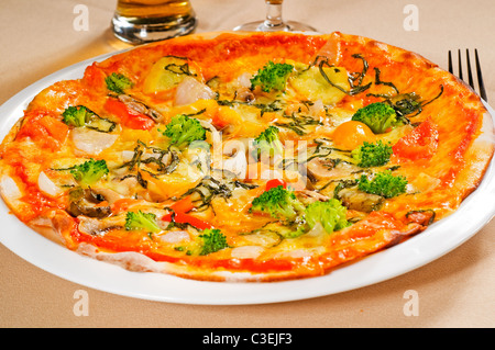 fresh italian thin style vegetarian pizza with fresh mixed vegetables close up Stock Photo