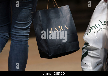 Shopping bags being carried in Oxford Street, London, England Stock Photo