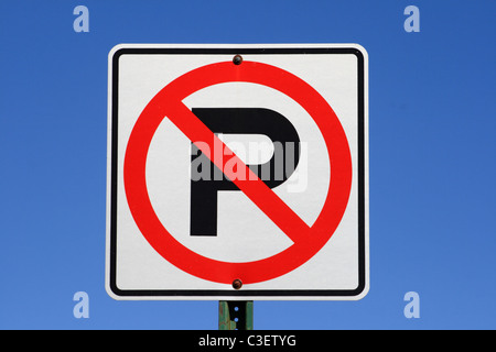 white red and black no parking sign with blue sky background Stock Photo