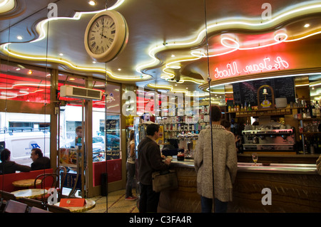 Reflections in a cafe bar tabac mirrored wall A Jean Nicot Rue Saint Honore 1er Paris France Stock Photo