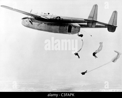 Paratroopers jumping from a Fairchild C-82 Packet - 1940's Stock Photo