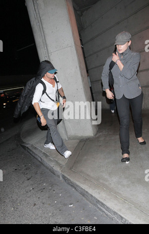 Ryan Phillippe and Abby Cornish  arrive at LAX on a flight from Toronto, surrounded by photographers. Los Angeles, California - Stock Photo