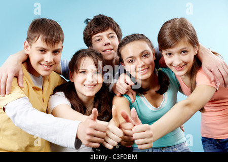 Portrait of five positive hens showing big thumbs Stock Photo