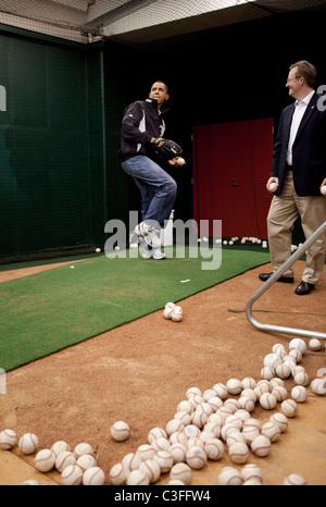President Barack Obama  practices throwing out the first pitch with St. Louis Cardinals first baseman Albert Pujols before the Stock Photo
