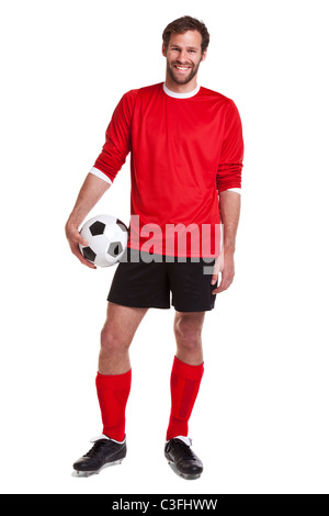 Photo of a footballer or soccer player cut out on a white background,. Stock Photo