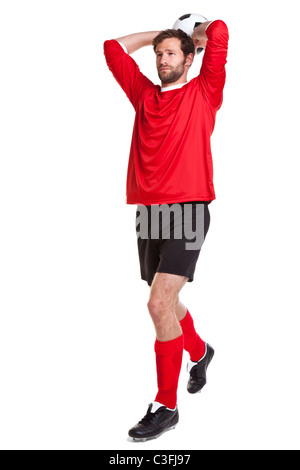 Photo of a footballer or soccer player cut out on a white background,. Stock Photo