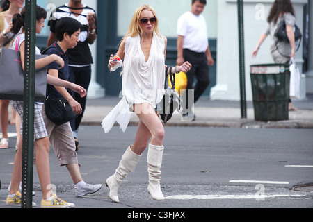 Lindsay Lohan out shopping in SoHo wearing very short shorts and white knee-high boots New York City, USA - 20.08.09 Stock Photo