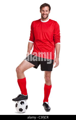 Photo of a footballer or soccer player cut out on a white background,. Stock Photo