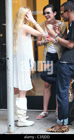 Lindsay Lohan out shopping in SoHo wearing very short shorts and white knee-high boots. Lindsay was out with her sister Ali Stock Photo