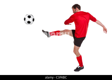 Photo of a footballer or soccer player cut out on a white background,. Stock Photo