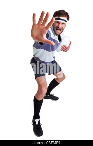 Photo of a rugby player handing off, cut out on a white background. Stock Photo