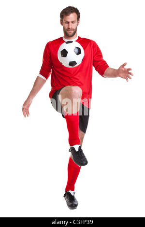 Photo of a footballer or soccer player cut out on a white background,. Stock Photo