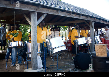 Steel drum band plays at Shirley heights in Antigua Stock Photo