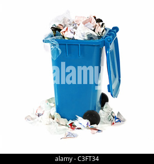 overflowing blue garbage bin on white background Stock Photo