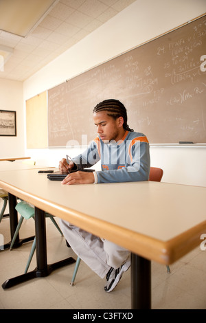 Peruvian student studying in classroom on laptop Stock Photo