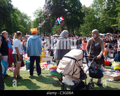 Integration, muslim women visiting the flea market on april 30th, queen's day, in Valkenberg park in Breda, the Netherlands Stock Photo