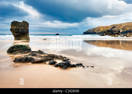 The black rocks at Sango Bay beach, Nr Durness, Sutherland on the North coast of Scotland. Taken on a sunny and stormy day. Stock Photo