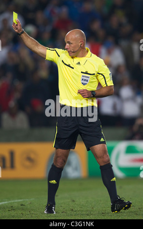 Referee Howard Webb issues a yellow card caution during a FIFA World
