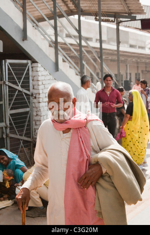 Man walking at a railway station, Ahmedabad, Gujarat, India Stock Photo