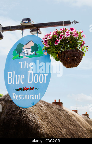Low angle view of signboard of a restaurant, The Blue Door Restaurant, Adare, County Limerick, Republic of Ireland Stock Photo