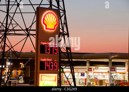 A petrol sation in Billingham on Teeside, UK, with an electricity pylon at dusk. Stock Photo