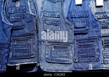 Denim blue jeans vest rows in a retail fashion shop Stock Photo