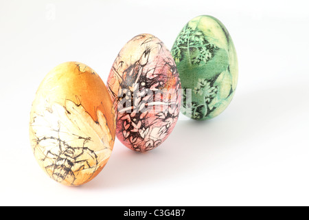 Three hand painted Easter eggs from Slovakia, isolated on white background. Stock Photo