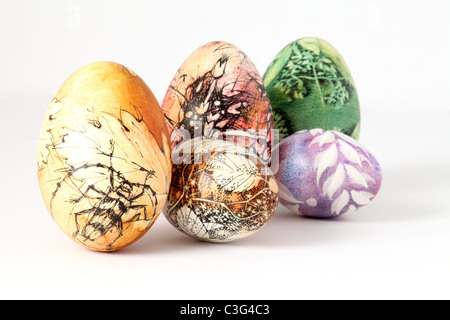 Five hand painted Easter eggs from Slovakia, isolated on white background. Stock Photo