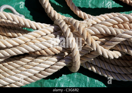 marine clear white used rope over green background
