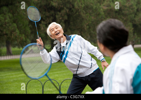 Senior Couple Playing Badminton in a Park Stock Photo