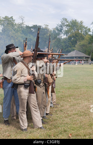 Civil war re-enactors firing in a line. Stock Photo