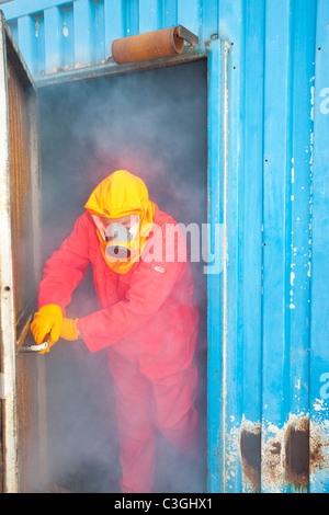 Workers in the offshore industry practice escaping from a smoke chamber as part of an industry training course, Stock Photo