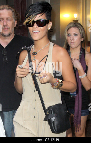 Rihanna showing off her tiger print nail polish while leaving her Manhattan hotel New York City, USA - 09.09.09 Stock Photo