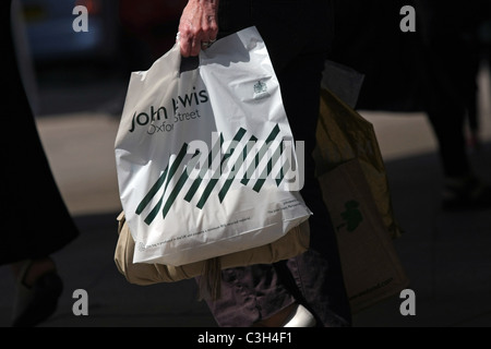 Shopping bags being carried by a female in Oxford Street, London, England Stock Photo