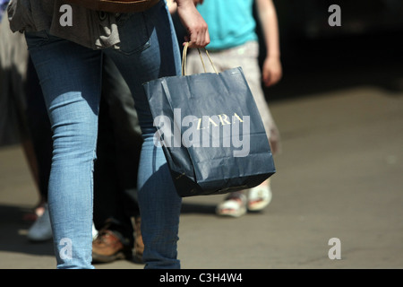 Shopping bag being carried in Oxford Street, London, England Stock Photo