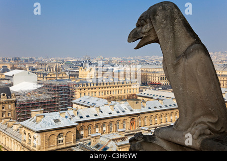 Famous chimera of Notre-Dame overlooking Paris. View from the top of Notre-Dame de Paris, France. Stock Photo