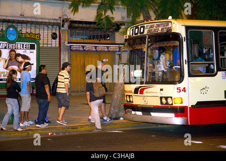 People boarding a public transportation bus in Buenos Aires, Argentina. Stock Photo