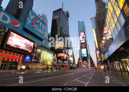 Storefronts and advertisements in an unusually empty Times Square New York City at dawn. Stock Photo