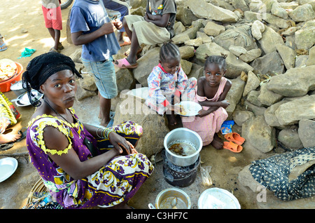 Woman preparing food in town of Beni, in the Eastern part of Democratic Republic of Congo in January 2011. Stock Photo