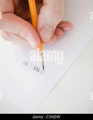 Hand filling document Stock Photo