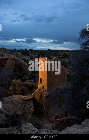 The Holly Tower sits on tall, narrow boulder at dusk at Hovenweep National Monument in southern Utah, USA. Stock Photo