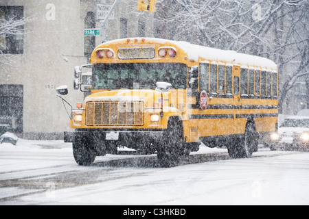 USA, New York City, school bus in blizzard Stock Photo